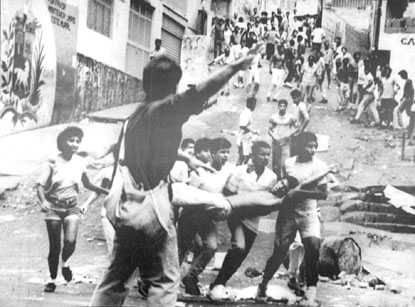 caracazo3 People going "down" from the slums located in the "misery belt" of Caracas hills, fighting against the police and military forces, 1989.